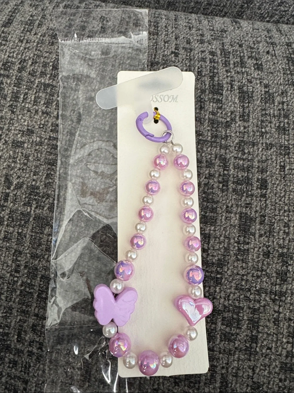 Purple Beaded Phone Wristlet with Butterfly & Heart Charm .